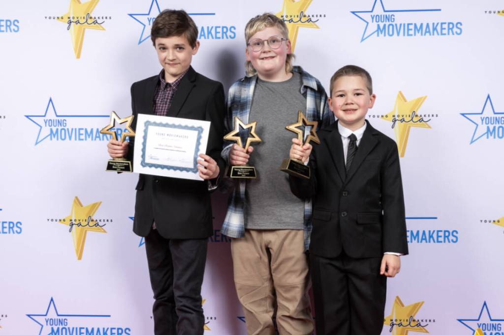 (L-R) Asher Loewen, Beau Winship, and Grayson Weismiller accepted the award for Best Picture at the 2026 Young Moviemakers gala for their short film Ring of the Nerds. (Young Moviemakers/Screenshot)