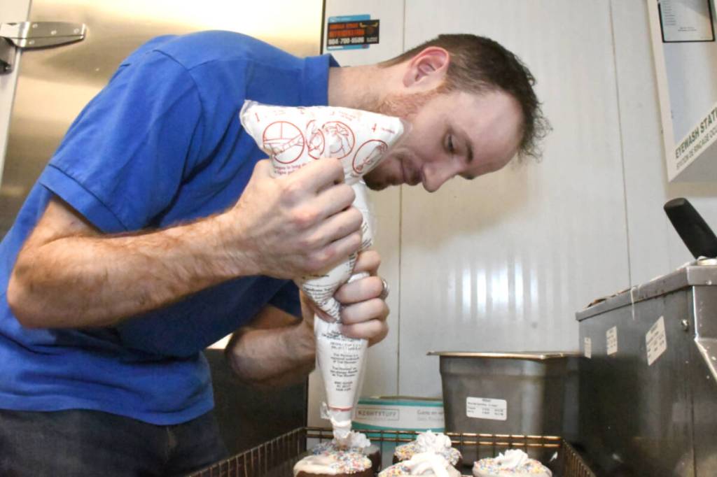 The Willoughby Tim Hortons allowed Langley Special Olympics members, such as Stephen Metcalfe, make a few donuts. (Heather Colpitts/Langley Advance Times)