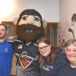 Stephen Metcalfe (left), Marissa Metcalfe, and Jenifer Burton met Jack the mascot of the Vancouver Giants at the launch of the Tim Horton fundraising donut sale to benefit Special Olympics. (Heather Colpitts/Langley Advance Times)
