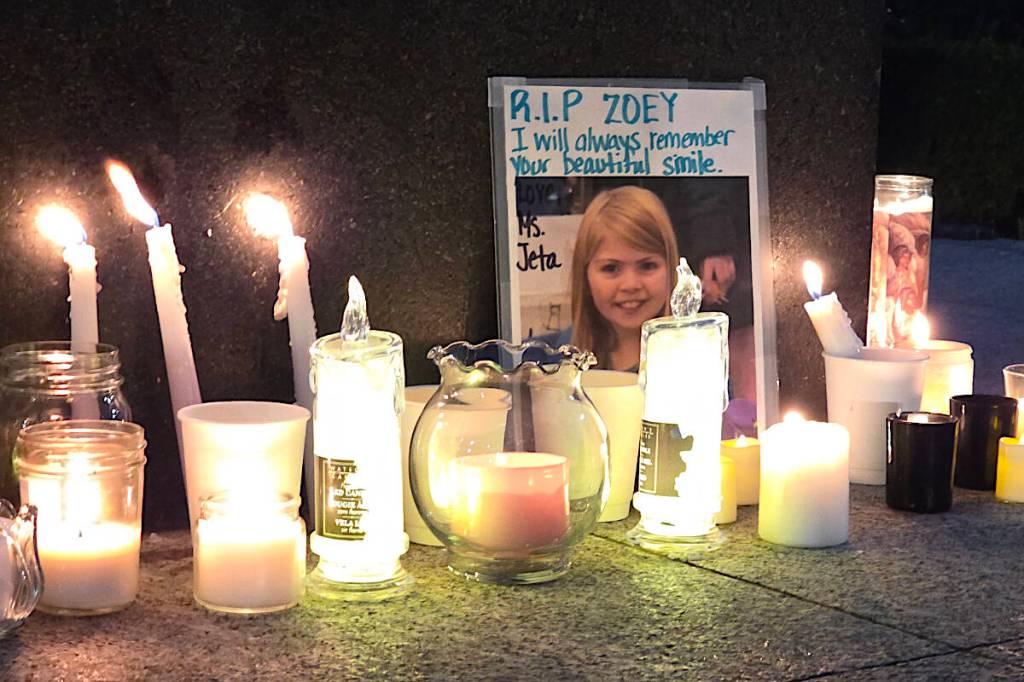 A crowd of people gathered in Langley City&rsquo;s Douglas Park Sunday for a candlelight vigil and moment of silence to honour the victims of the Tumbler Ridge shootings and the memory of Zoey Benoit, who studied at a local school. (Dan Ferguson/Langley Advance Times)