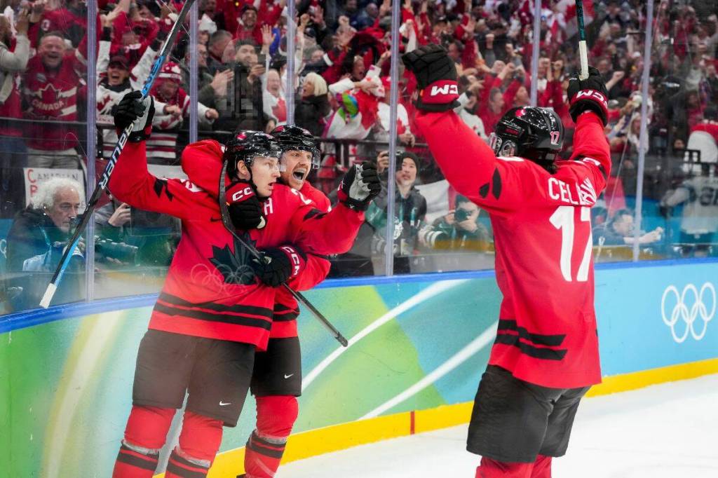 Team Canada&rsquo;s Nathan MacKinnon (29) celebrates scoring a go ahead goal against Finland with teammates Sam Reinhart (13) and Macklin Celebrini (17) during the third period in men&rsquo;s ice hockey semi-finals at the Milano Cortina 2026 Olympic Winter Games in Italy on Friday, February 20, 2026. Photo by Leah Hennel/COC MANDATORY CREDIT