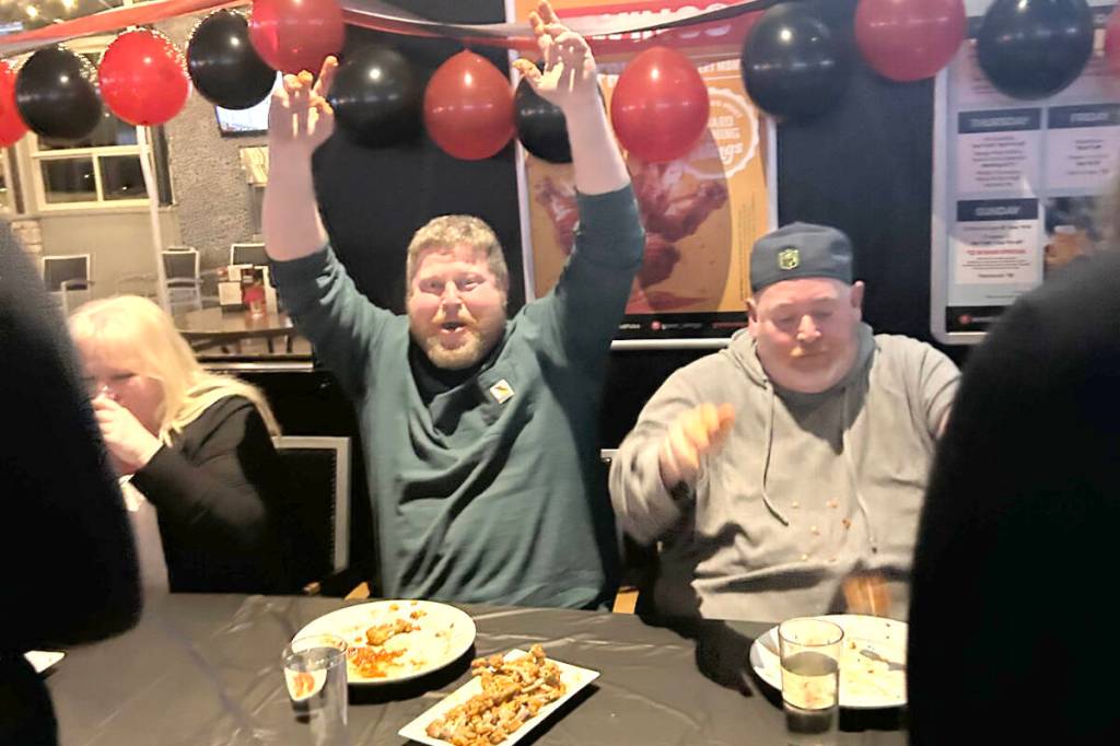 At the Wings restaurant in Langley on Jan. 29, Maple Ridge&rsquo;s Jeff LaBelle (centre) went up against a dozen fellow wing enthusiasts in an eating contest. He won, and advances to the provincial finals Feb. 26 in Port Moody. (Special to Black Press Media)