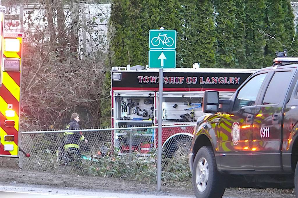 Fire crews were called to the scene between 240 and 244 Streets on Fraser Highway Saturday morning. (Dan Ferguson/Langley Advance Times)