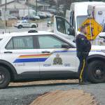 Fire crews were called to the scene between 240 and 244 Streets on Fraser Highway Saturday morning. Police blocked off traffic. (Dan Ferguson/Langley Advance Times)