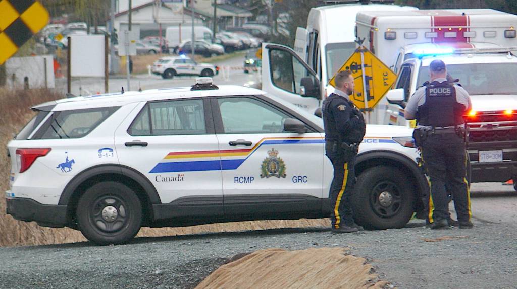 Fire crews were called to the scene between 240 and 244 Streets on Fraser Highway Saturday morning. Police blocked off traffic. (Dan Ferguson/Langley Advance Times)